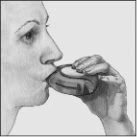 Profile of a person holding a tablet in their hand and placing it in their mouth to swallow