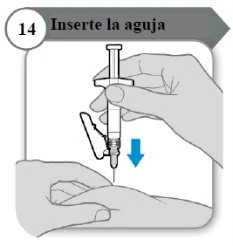 One hand holding a syringe with a