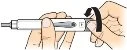 Two hands hold a white injection pen while one hand rotates a black protective cap located at the end