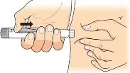 A hand holds an injection pen and presses it against the skin of the patient