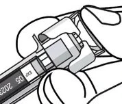 Two hands holding and rotating the top of an injection pen to remove the protective cap from the medical device