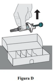 A hand holding a syringe with needle and blue cap above an open white cardboard box with internal compartments