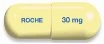 Yellow capsule divided into two parts with the word ROCHE on one side and the concentration '30 mg' on the other