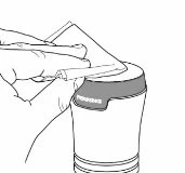A hand holds an injection pen and positions it over the cap of a cylindrical container for drug preparation