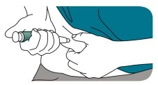Two hands holding an injection pen ready for use