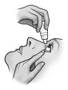 Black and white drawing of a hand holding an applicator above the