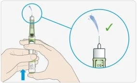 Two hands holding an injection pen with a magnified view showing the medication stream exiting from the