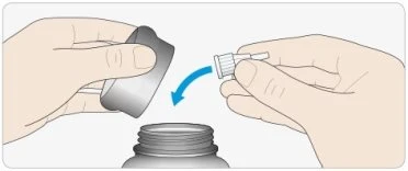 Two hands unscrewing or screwing a white cap with a nozzle onto a gray medicine vial with a curved blue arrow