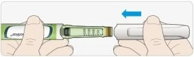 Two hands holding two white and green medical devices, with a blue arrow indicating the joining movement between the two components