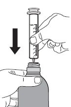 A hand holding a graduated syringe and pushing it downward with a black arrow indicating aspiration of the content from a medicine bottle