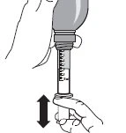 A hand holding the base of a syringe containing liquid
