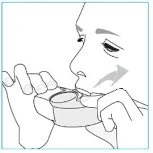 Black and white drawing of a person holding a container with mouth open to take the medication via inhalation