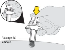Hands pressing the upper button of a syringe downward, with a yellow arrow indicating the direction of movement downward