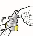 A hand rotates the upper cap of a yellow and gray medical device to open or prepare it for