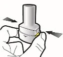 A hand holds a white cylindrical medical device with black arrows indicating lateral rotational movement
