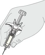 A hand holding a syringe containing liquid
