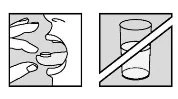 Drawing showing a person placing a tablet into their mouth next to a glass of water