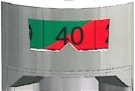 Close-up of a graduated indicator on a medical device showing a green band with the number 40 and a red band against a metallic background