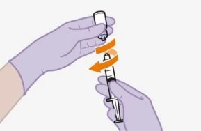 Two gloved hands rotating a white vial above a syringe with orange arrows indicating rotational movement for