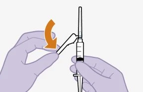 Two gloved hands rotating the upper part of a syringe with an orange arrow indicating the unscrewing motion of the cap
