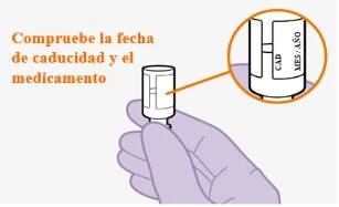 A hand holding a medical device with an inset showing a close-up view