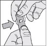Two hands holding and lifting a paper strip with a central hole indicated by an arrow pointing towards it