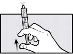 A hand holds a syringe with the
