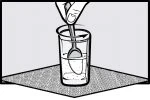 A hand holds a spoon at the