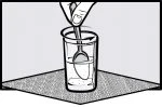 A hand holds a spoon at the