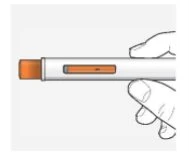 A hand holding horizontally a white injection pen with a rectangular orange window on the body of the device