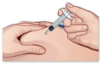 A hand holding a syringe and inserting it into the thigh muscle