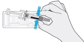A hand holding a pre-filled syringe above a white container with two blue arrows indicating the withdrawal motion