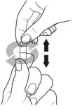 Two hands holding and moving a pharmaceutical capsule vertically, indicated by a double-headed black arrow