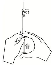 Two hands holding a syringe with needle pointing upward
