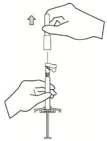 A hand vertically lifting a protective cap from a syringe held steady by another hand