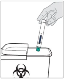 A hand holding an injection pen vertically, preparing to place it into a biohazard waste container with biohazard symbol
