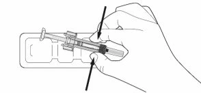 A hand holds a syringe above a blister pack while two black arrows indicate downward pressure movement for removal