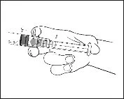A hand holding a syringe with the needle pointing upward