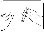 Two hands holding a syringe ready for