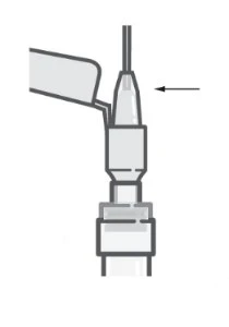 Diagrama técnico en blanco y negro que muestra el detalle de un dispositivo médico con una flecha que indica una parte superior específica