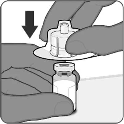 Two hands pressing a needle cap downward to pierce the top of a small glass vial containing liquid