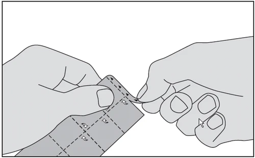 Two hands carefully separating two sheets of a medical blister pack along the dotted lines indicated by directional arrows