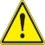Warning sign consisting of a yellow triangle with black border and a black exclamation mark at the center
