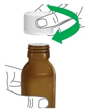 A hand holds a brown vial while the