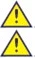 Two identical warning symbols consisting of a yellow triangle with black border containing a black exclamation mark at the center