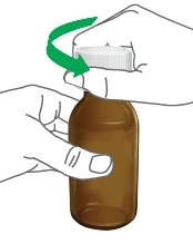 Two hands turning the white cap of a brown glass vial clockwise, indicated by a curved green arrow