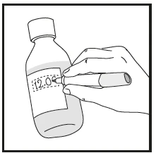 A hand holding a marker and writing the date 12.09 on a label