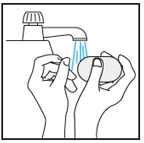 Two hands washing a bar of soap under a water stream