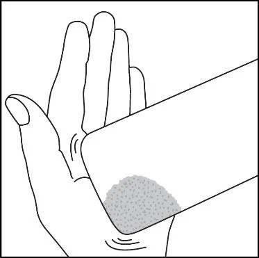 Black and white drawing of an open hand holding a rectangular object with a granular gray area on the lower surface
