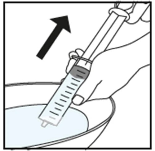 A hand holding a syringe to aspirate liquid from a circular container, with a black arrow indicating the downward movement